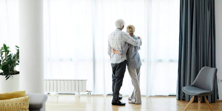 Elderly Couple in Bright Living Room at Independent Living Facility