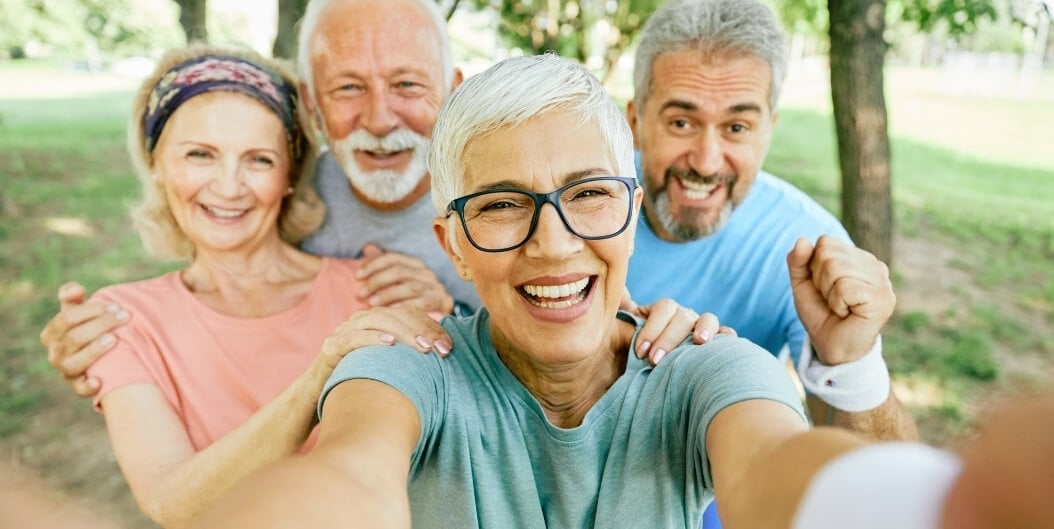 Group of Elderly Friends Smiling and Taking Selfie in Independent Living