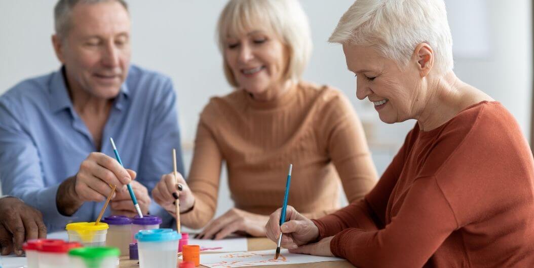 Elderly Group Painting with Watercolors at Independent Living Facility