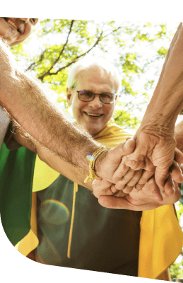 Elderly Group Joining Hands During Wellness Activity Independent Living Community Elderly Group Joining Hands During Wellness Activity Independent Living Community