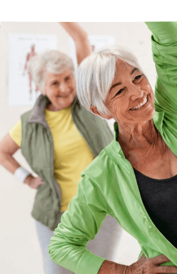 Elderly Women Stretching During Indoor Fitness Class Independent Living Elderly Women Stretching During Indoor Fitness Class Independent Living