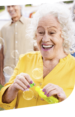 Elderly Woman Enjoying Bubbles During Social Activity Independent Living Facility Elderly Woman Enjoying Bubbles During Social Activity Independent Living Facility