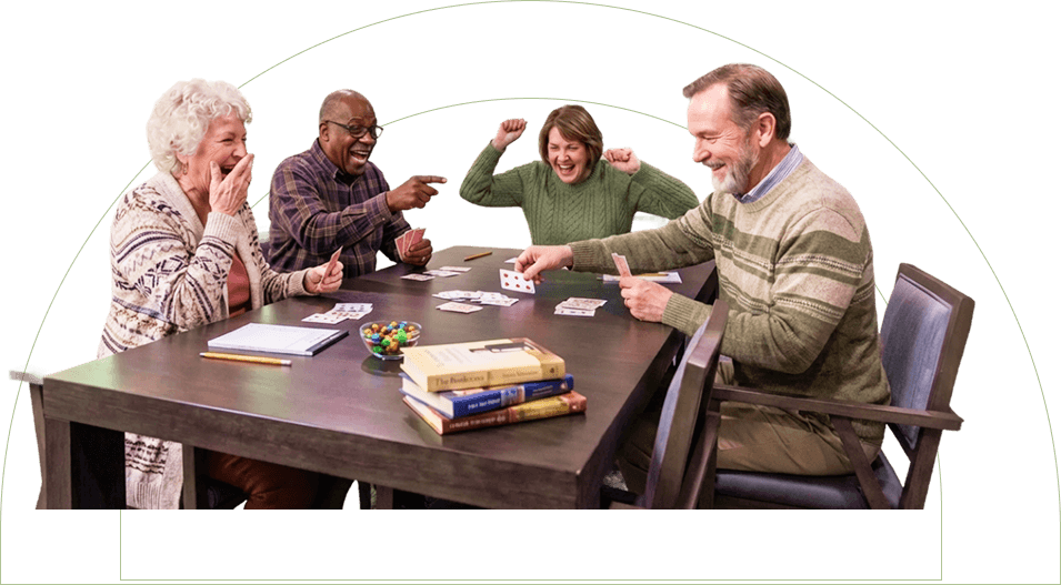 Elderly Residents Playing Cards Together in Social Lounge Independent Living Elderly Residents Playing Cards Together in Social Lounge Independent Living