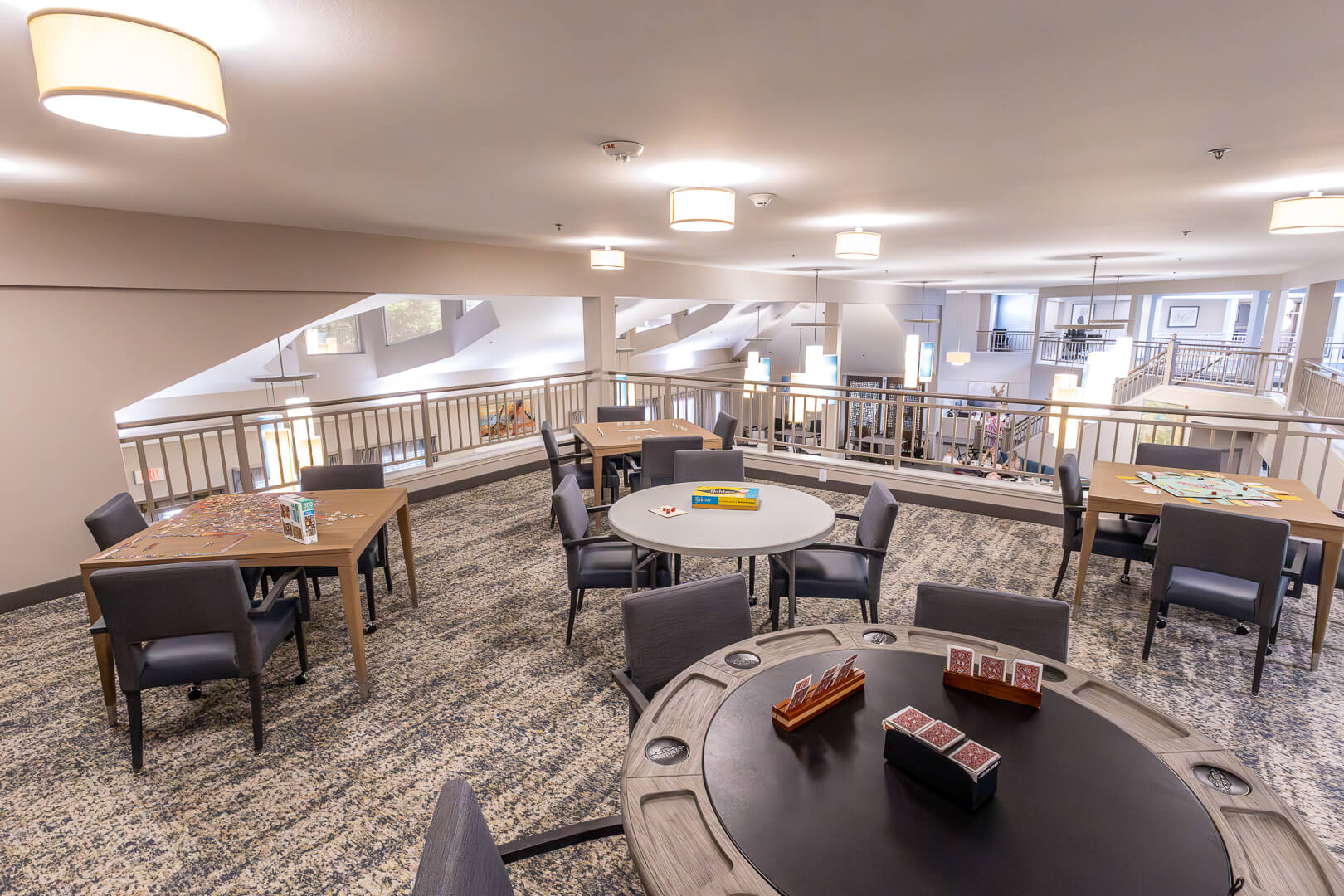 Upstairs Game Loft with Card Tables and Soft Seating in Our Independent Living Facility