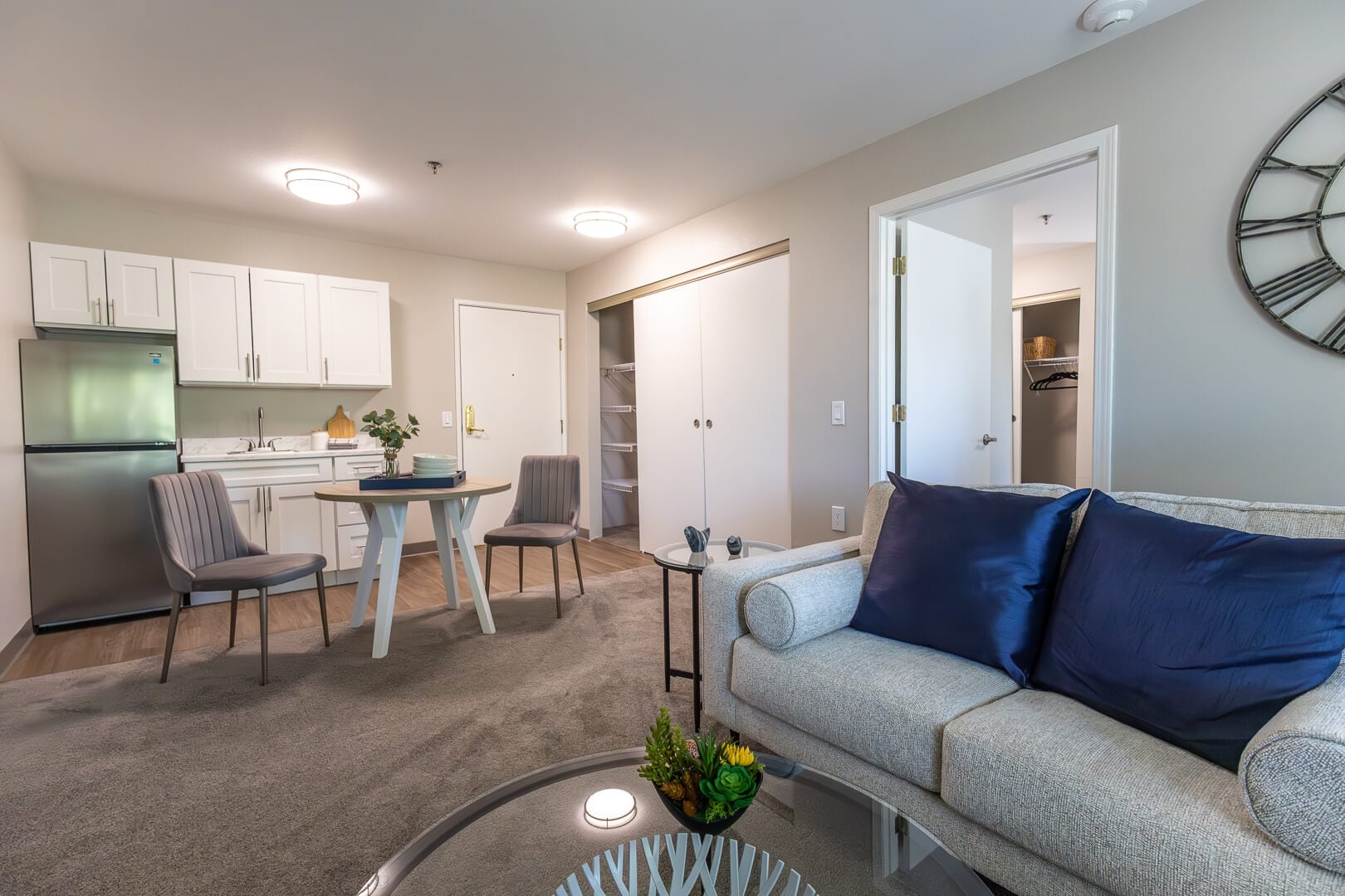 Open Apartment with Kitchenette, Dining Area, and Sofa in Our Independent Living Community
