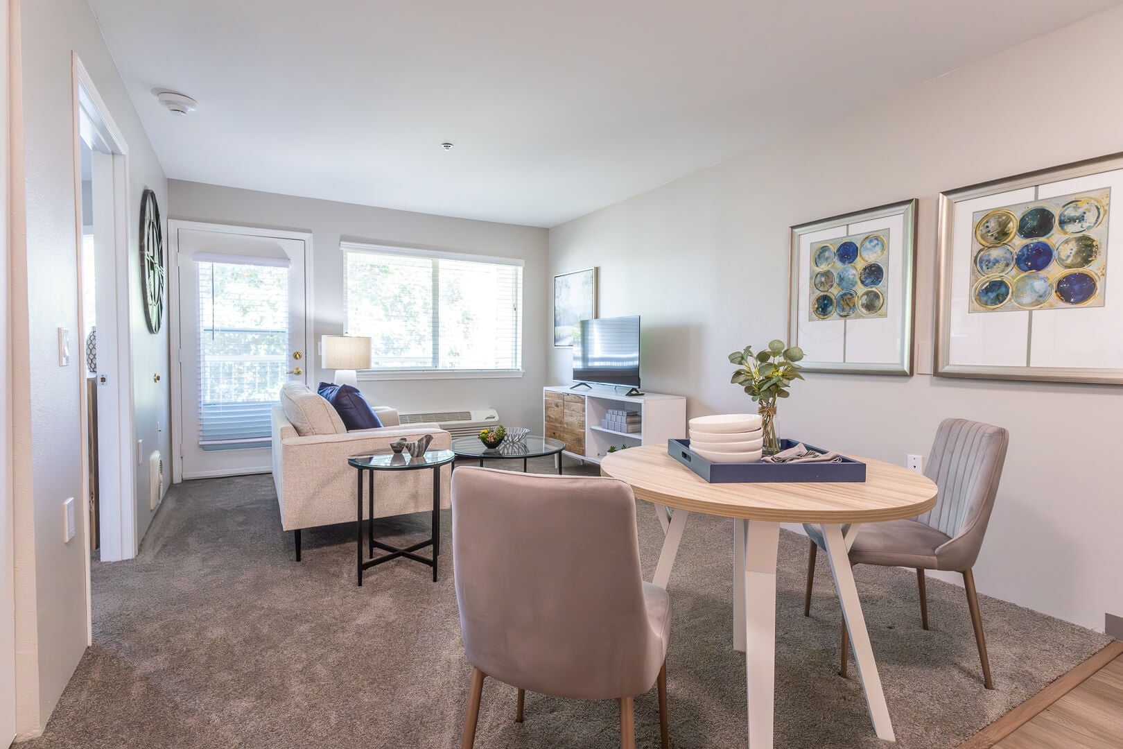 Sunlit Apartment Living Space with Dining Table and Patio in Our Independent Living Facility