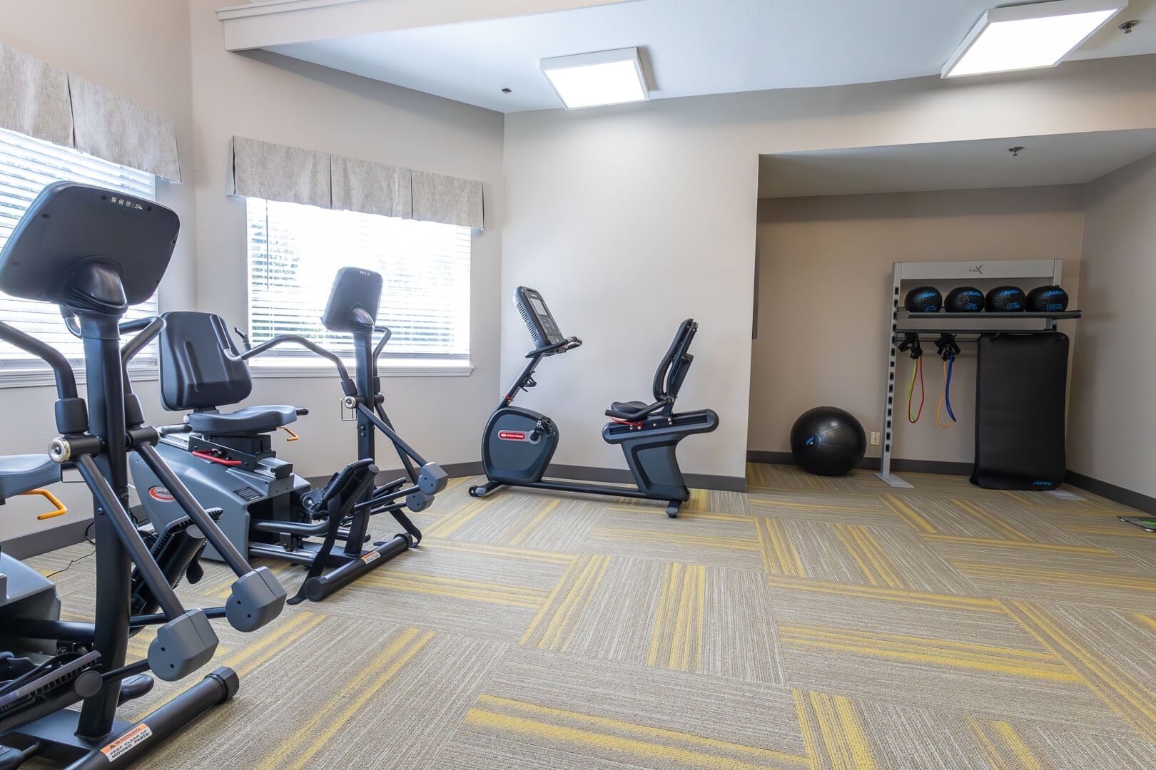 Equipped Fitness Room with Exercise Machines and Free Weights in Our Independent Living Community