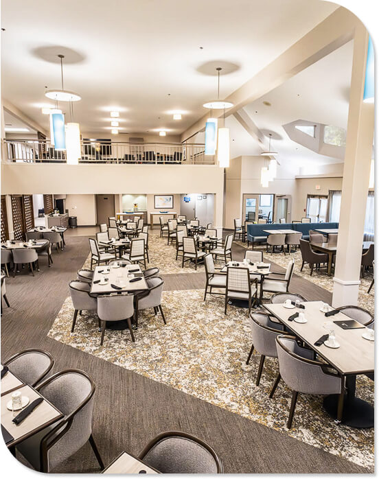 Spacious Dining Hall with Vaulted Ceilings and Fireplace in Independent Living Spacious Dining Hall with Vaulted Ceilings and Fireplace in Independent Living